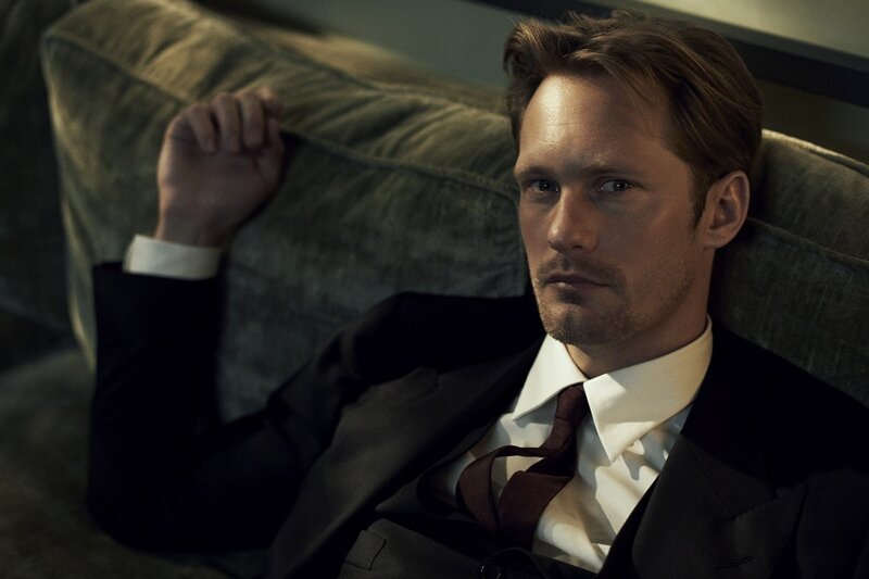 man in suit on couch