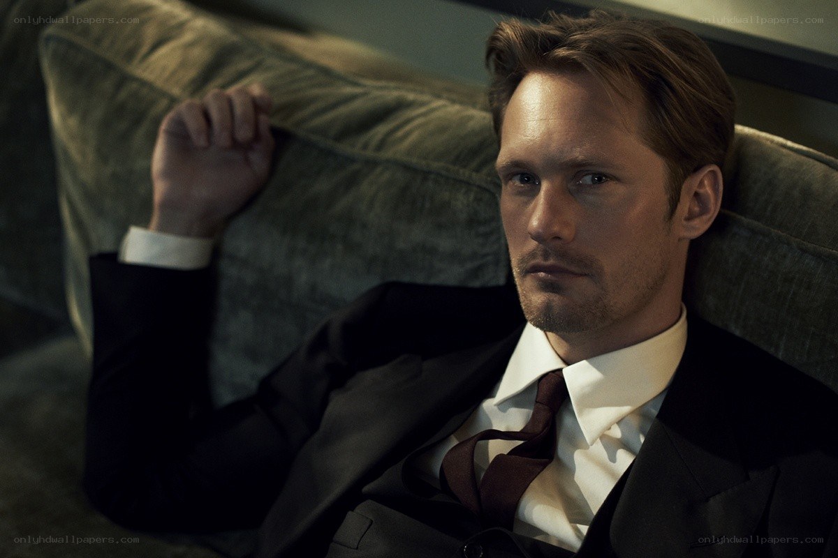 man in suit on couch