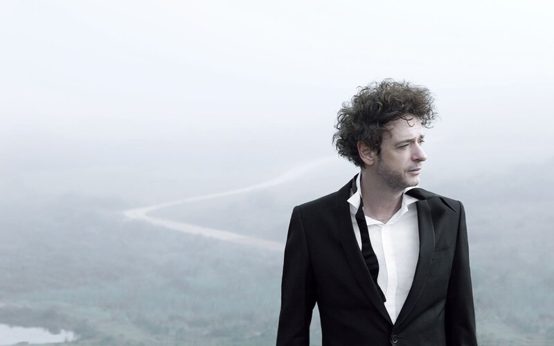 man in suit on foggy hill