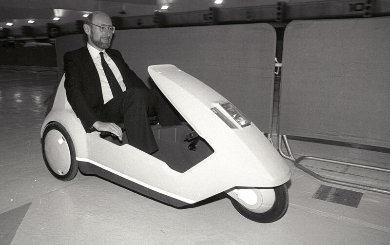 Man in suit on futuristic scooter