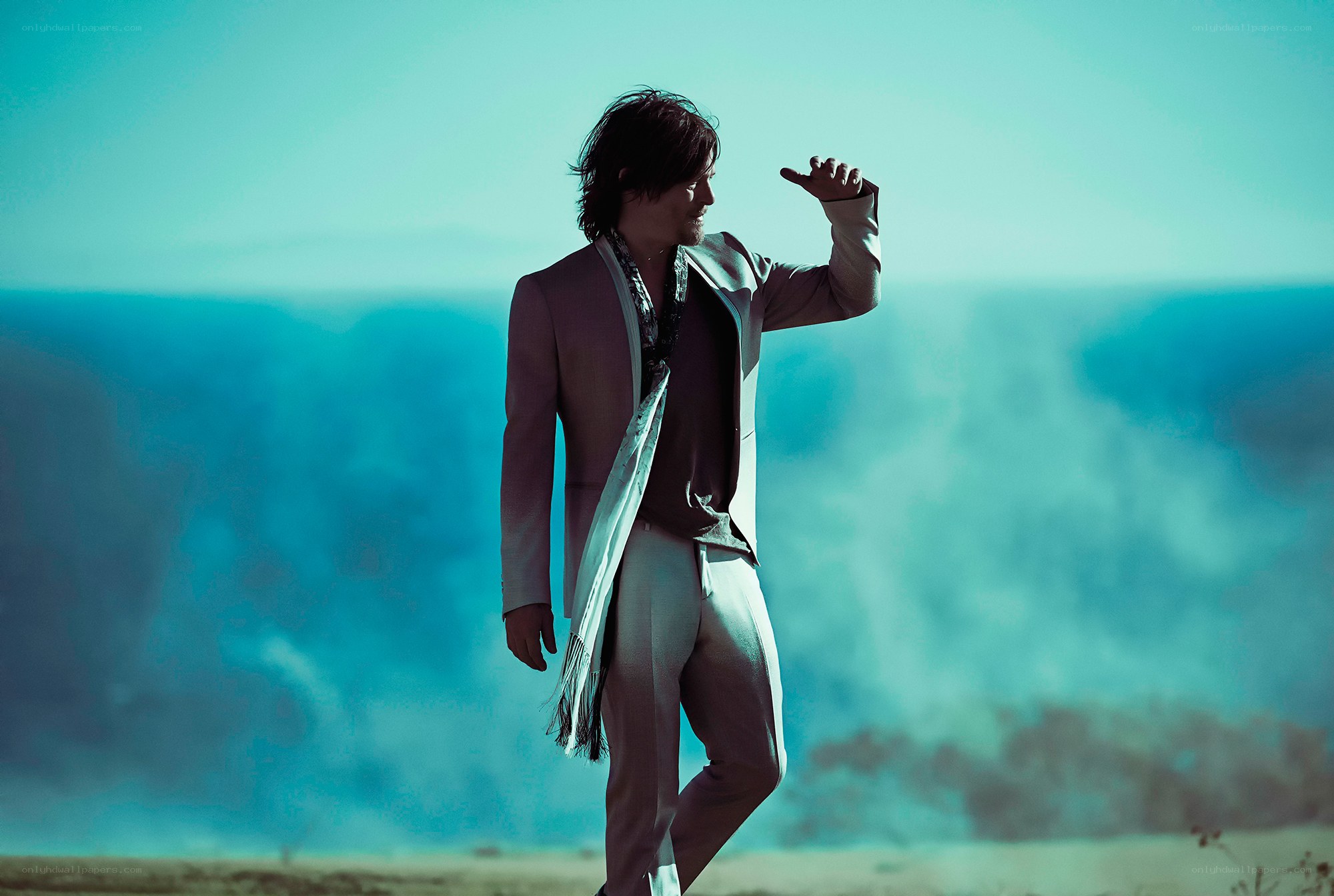 man in suit on hillside