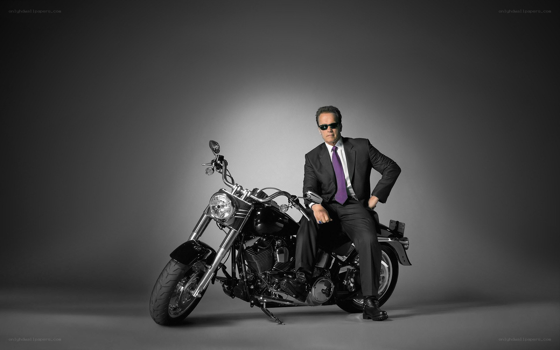 man in suit on motorcycle