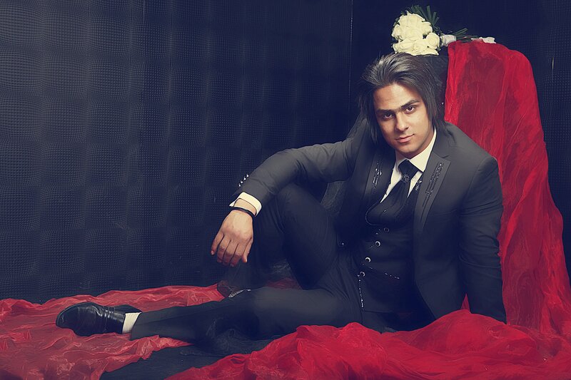 Man in suit on red fabric