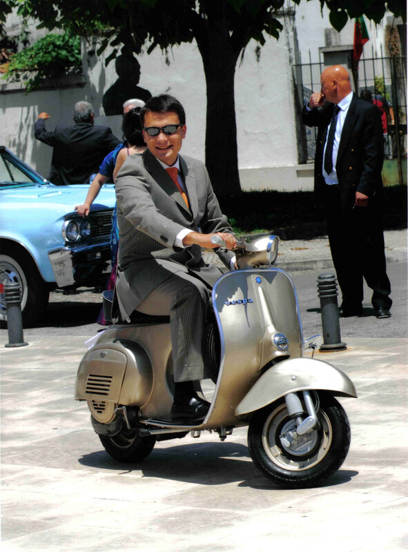Man in suit on scooter