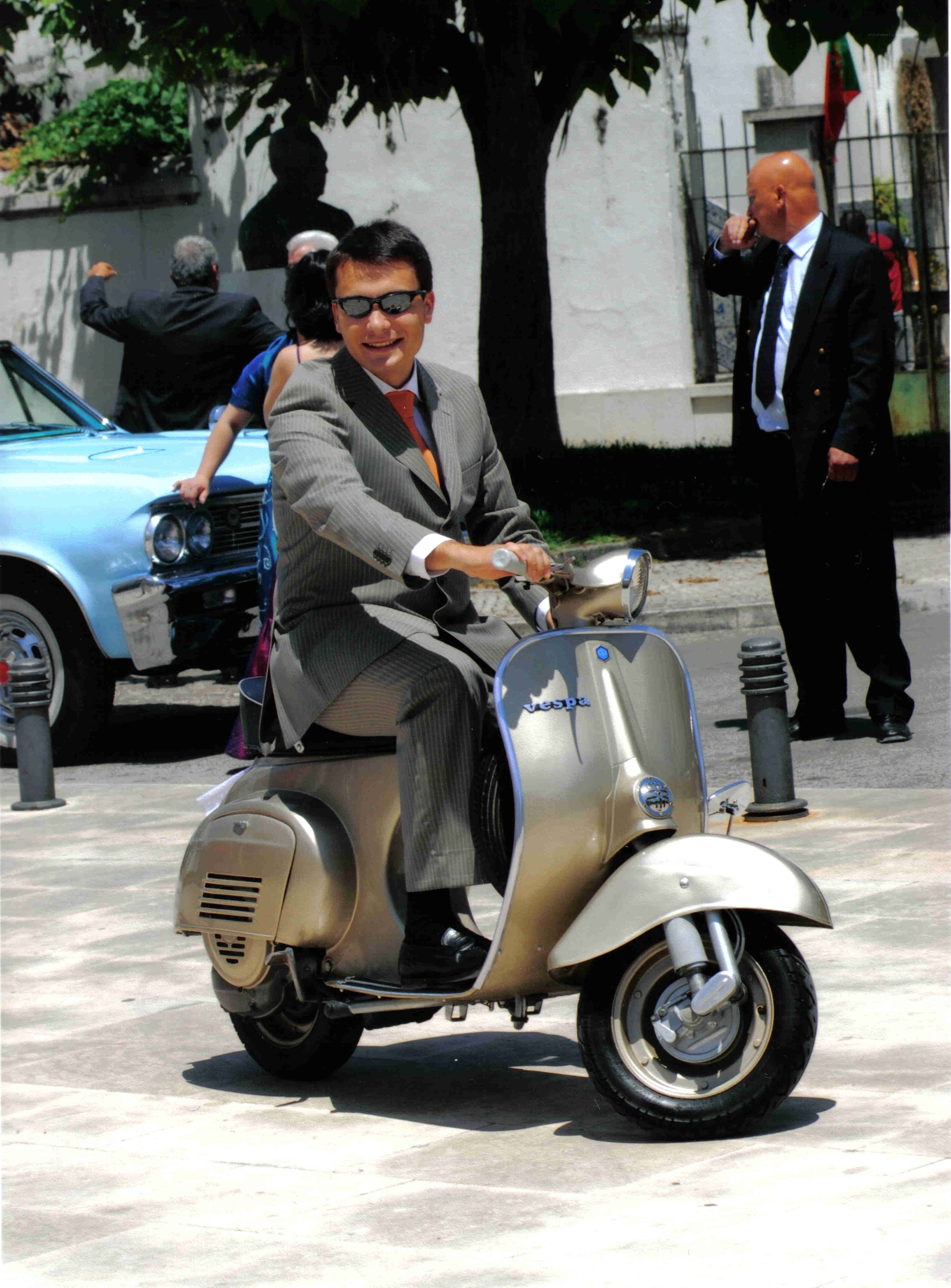 Man in suit on scooter
