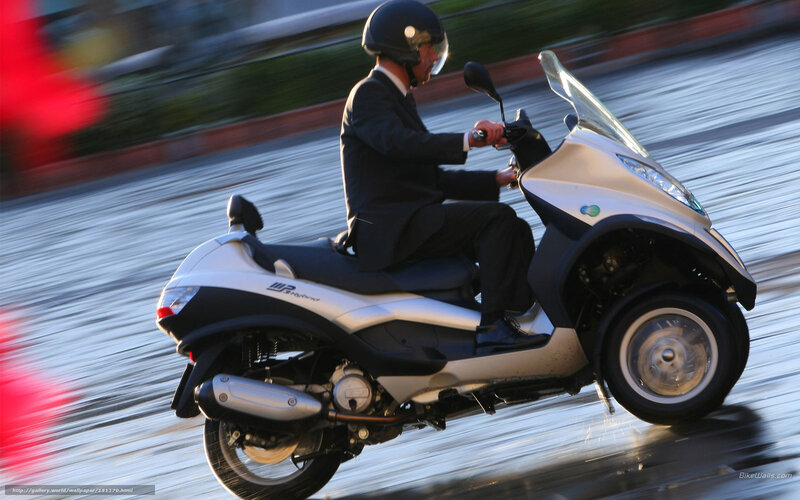 Man in Suit on Scooter — Silver