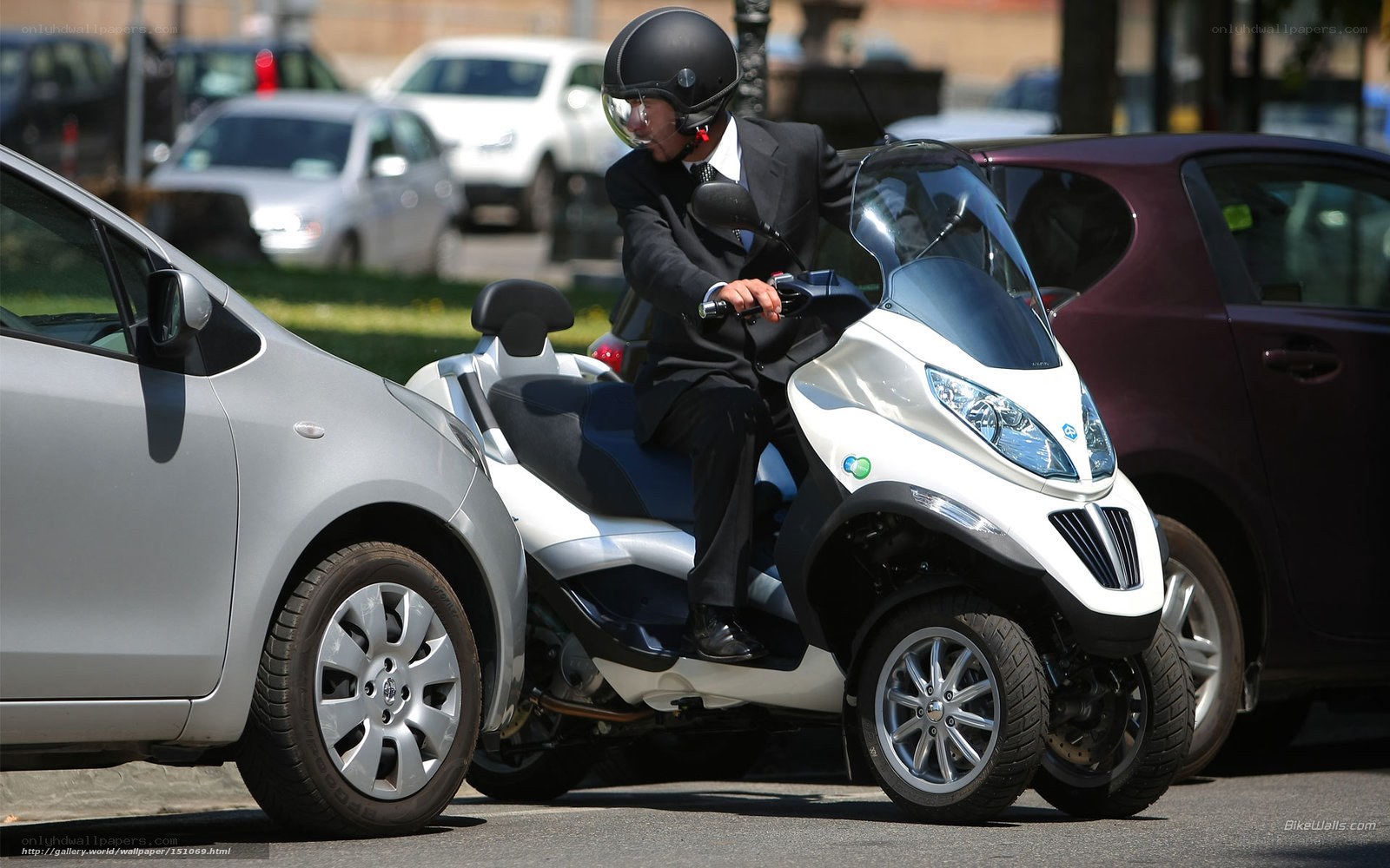 Man in suit on scooter