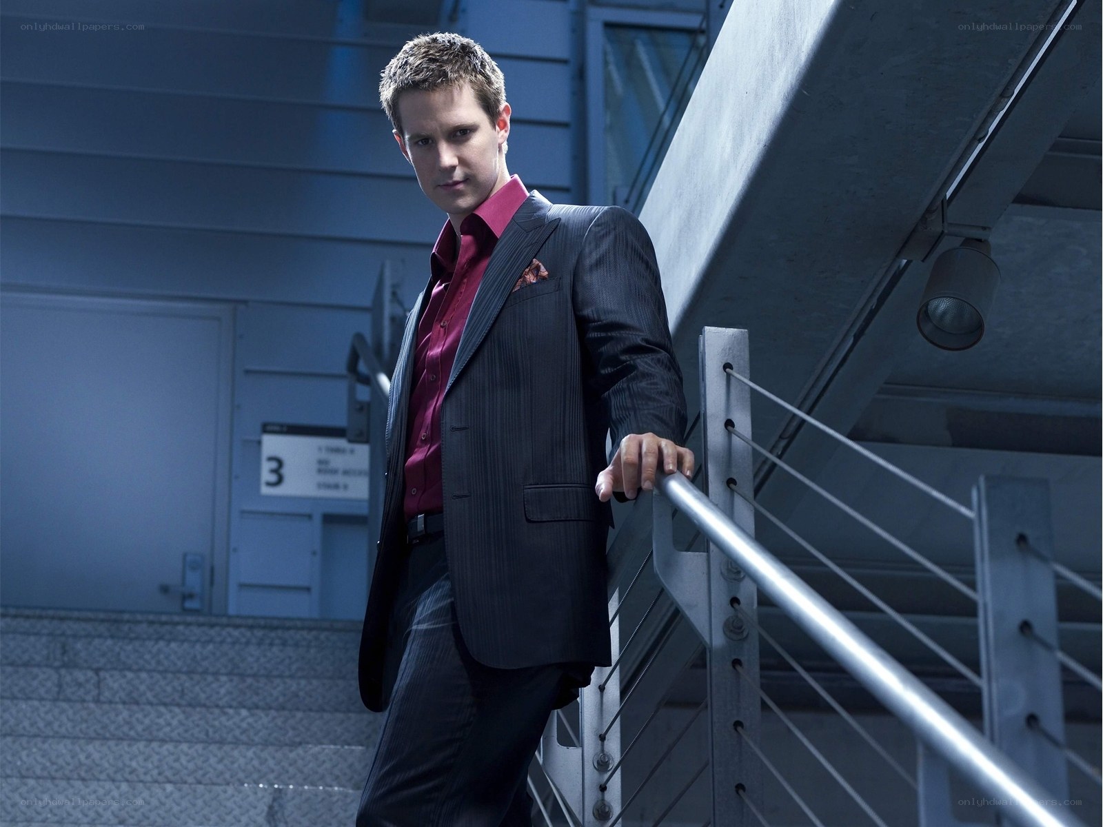 man in suit on staircase