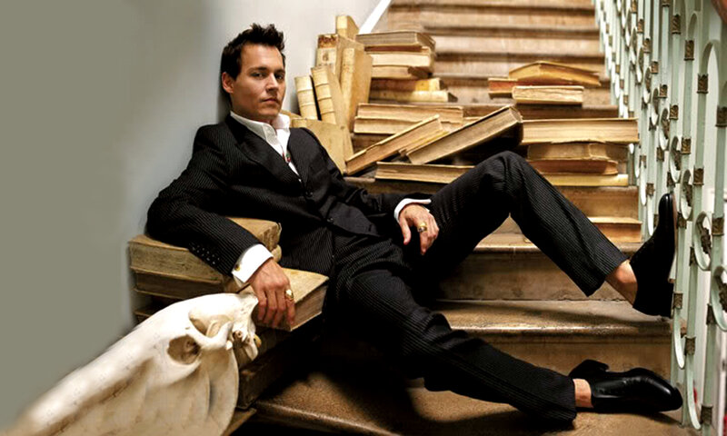 man in suit on stairs