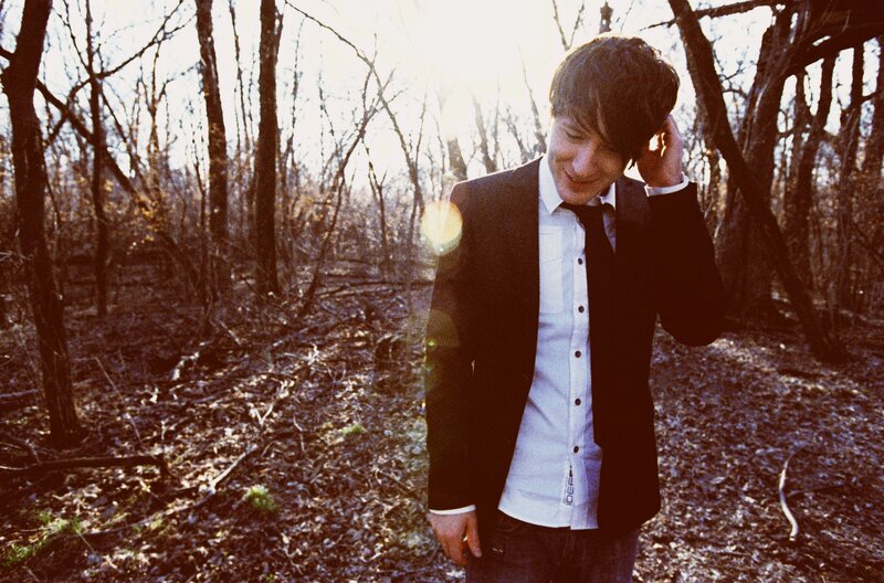 Man in Suit Outdoors — Brown