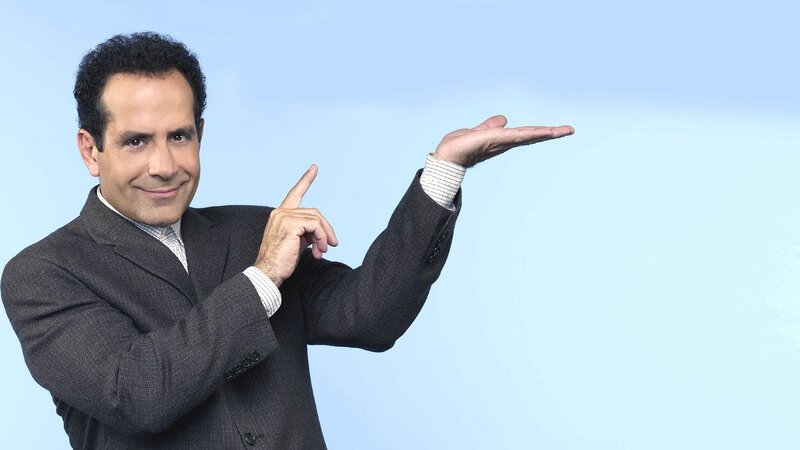 man in suit pointing