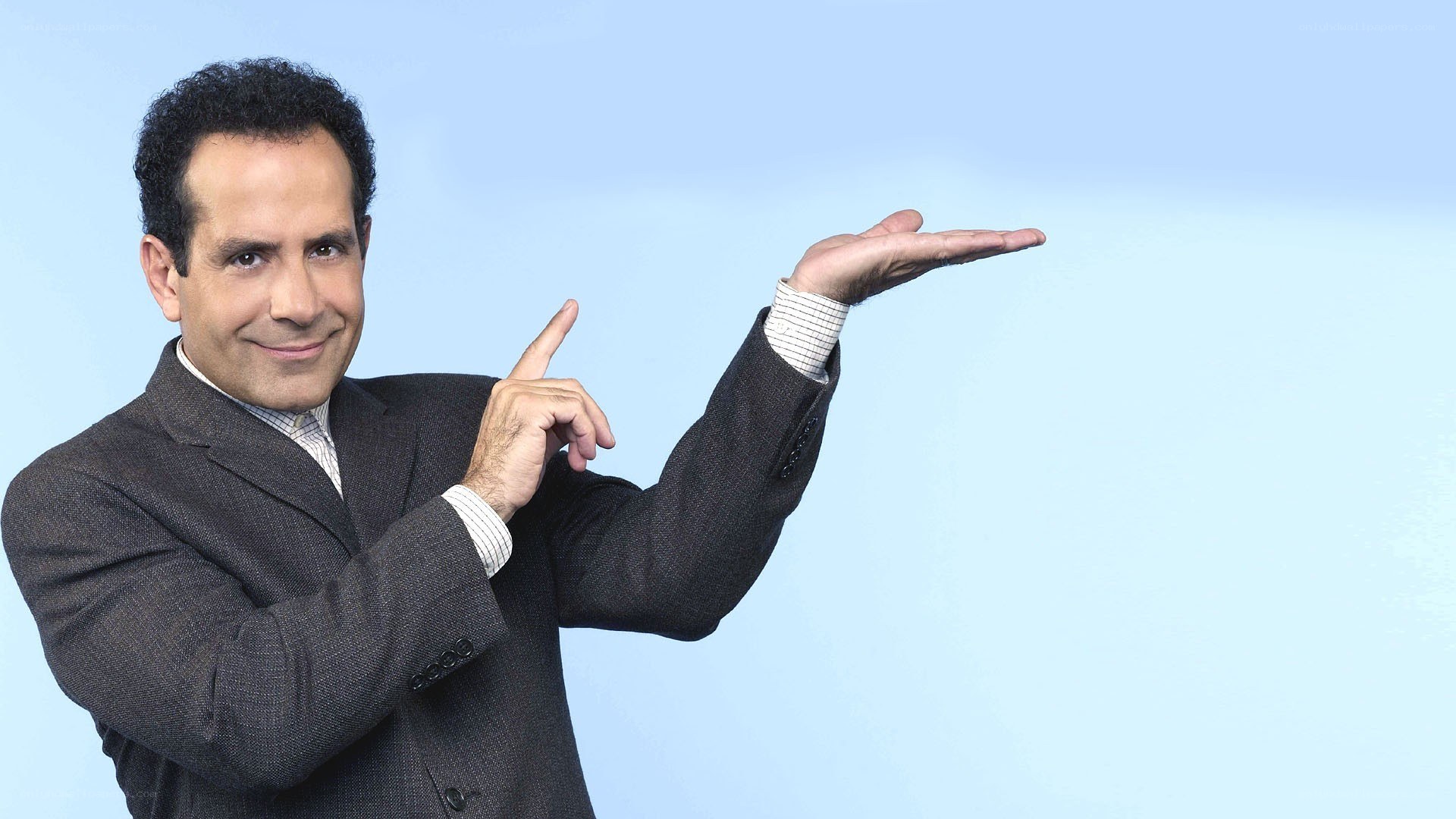 man in suit pointing