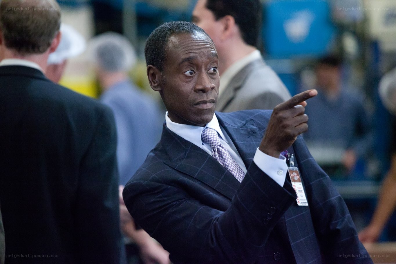 Man in suit pointing at something