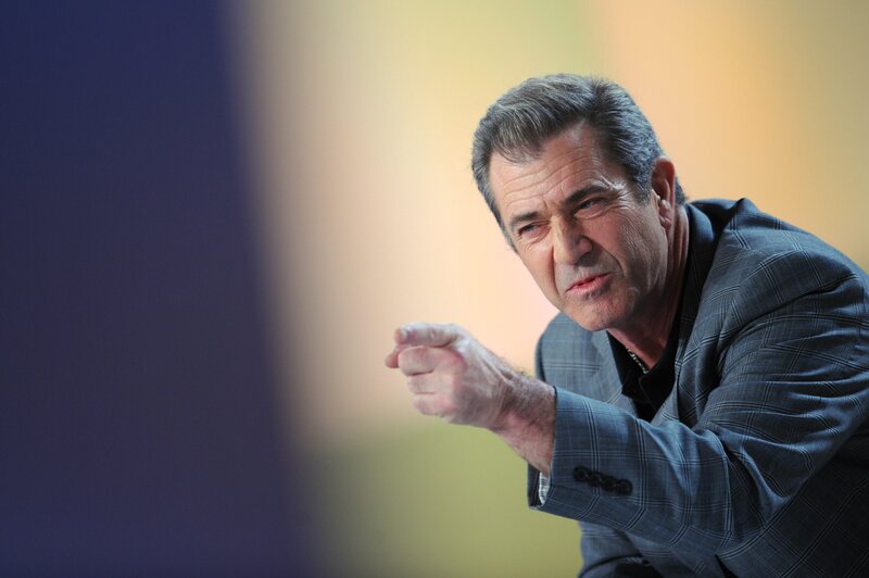 Man in Suit Pointing — Blue, Serious