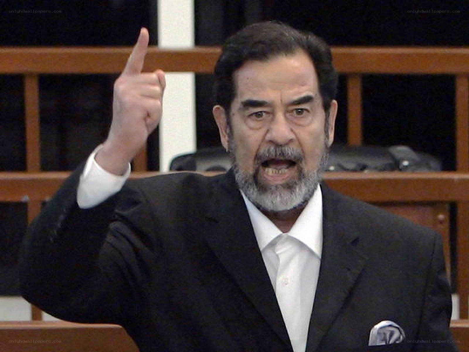 Man in suit pointing finger