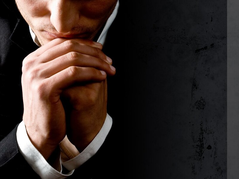 Man in Suit Praying