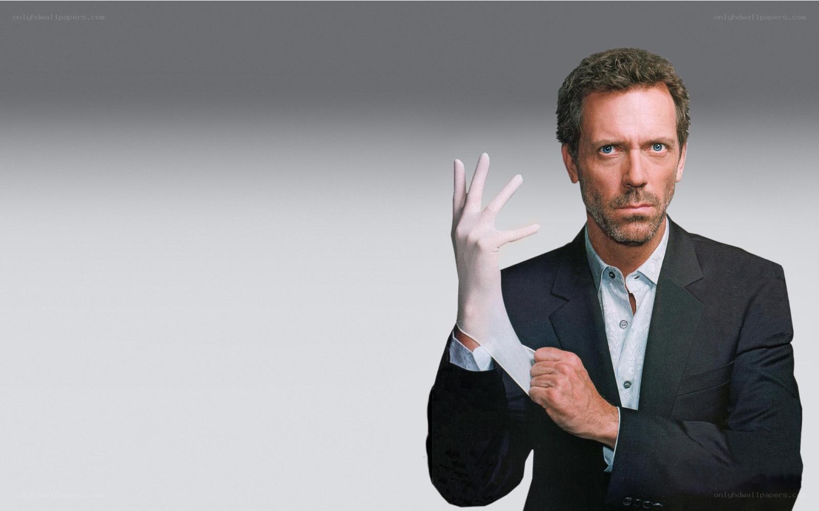 man in suit putting on glove