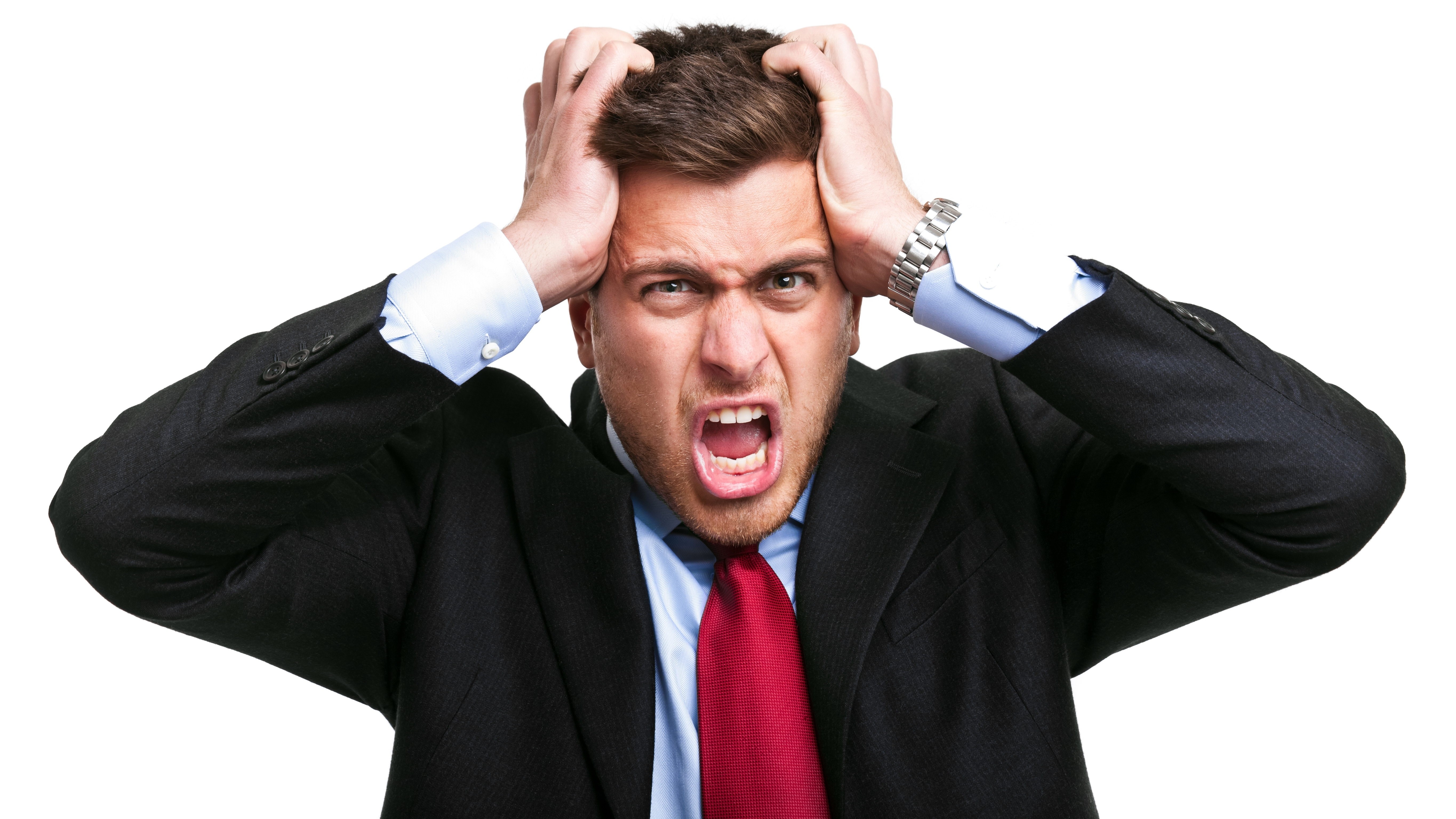 man in suit screaming in frustration
