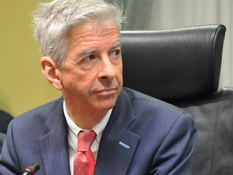 Man in Suit Sitting — Blue
