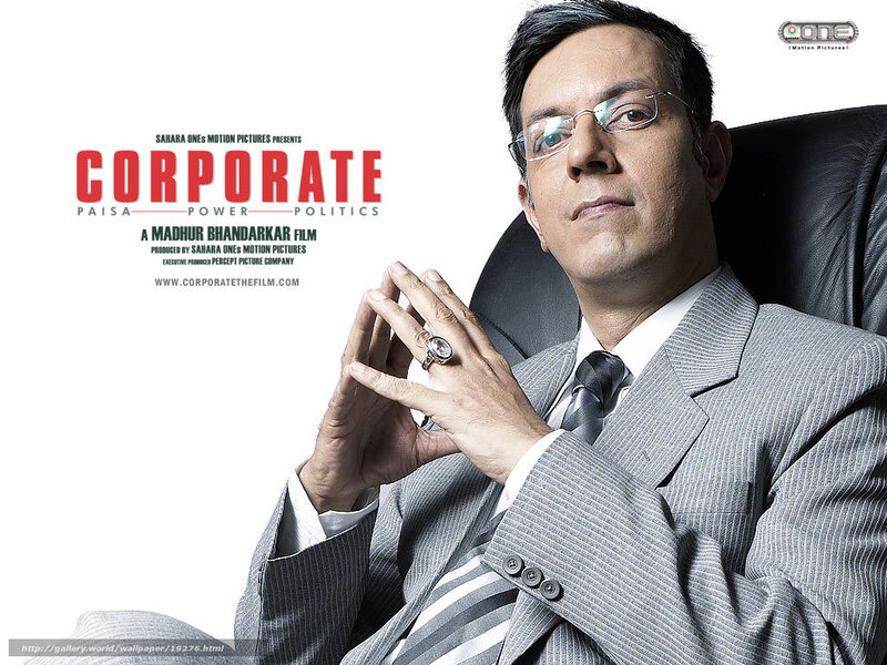 Man in Suit Sitting — Gray, Serious