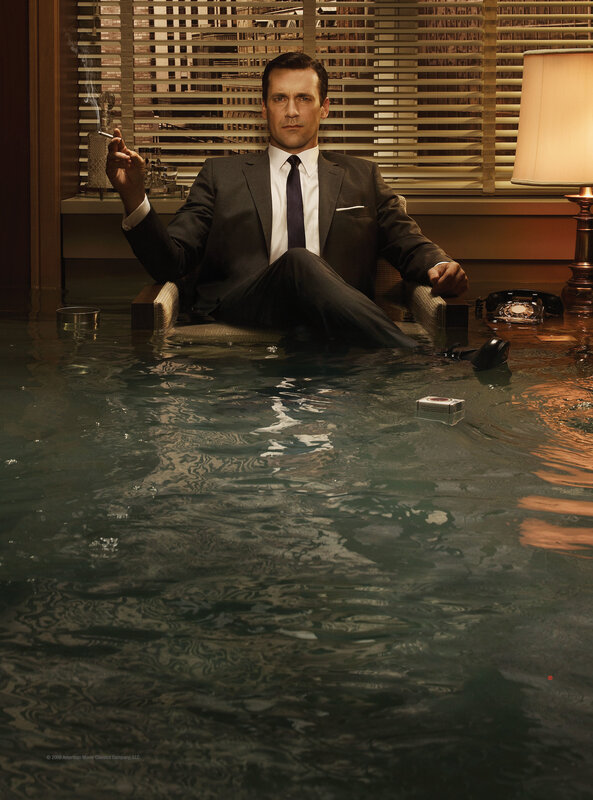 Man in suit sitting in flooded room
