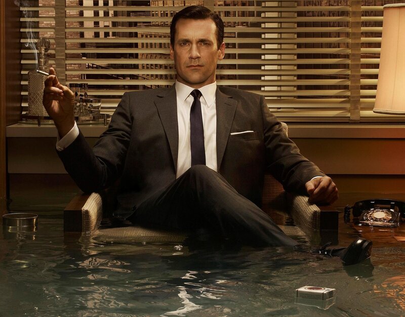 Man in suit sitting in water