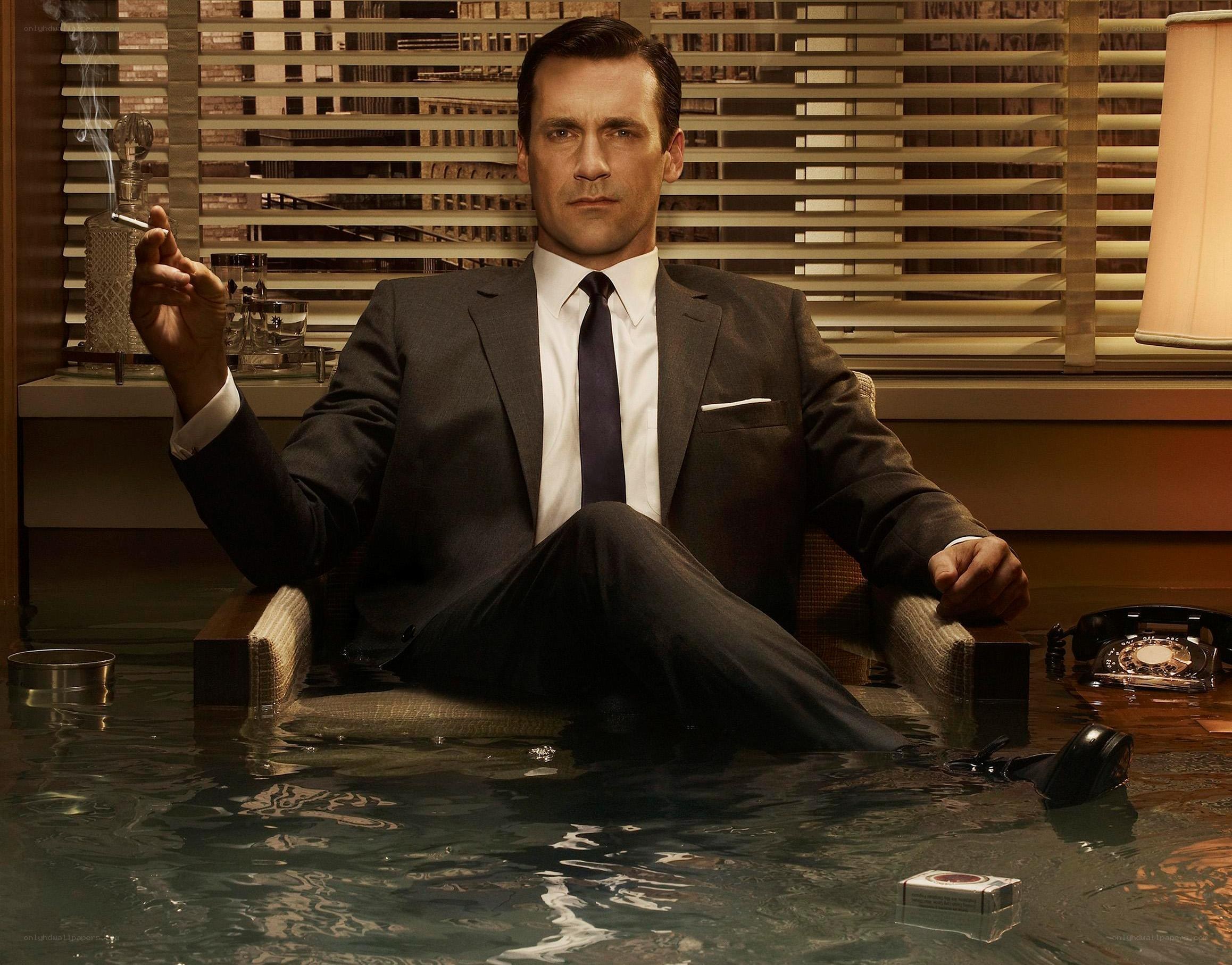 Man in suit sitting in water