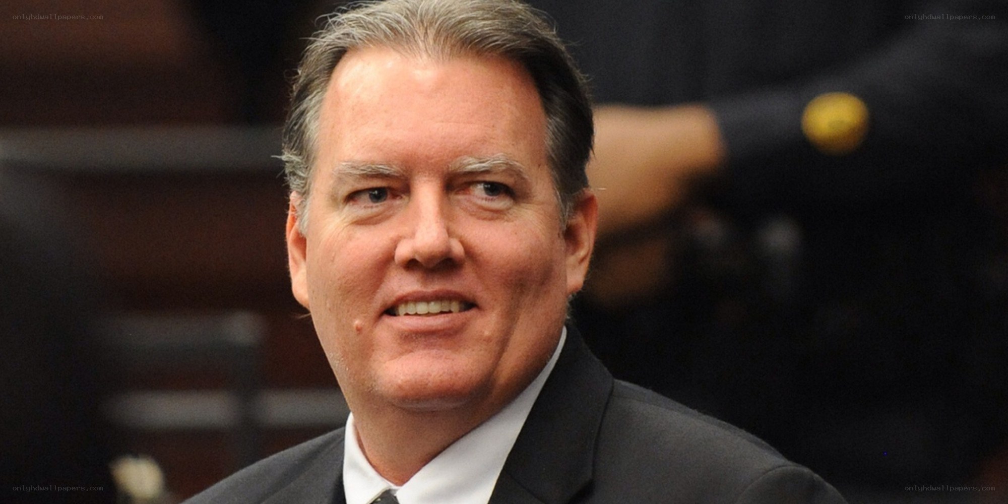 man in suit smiling