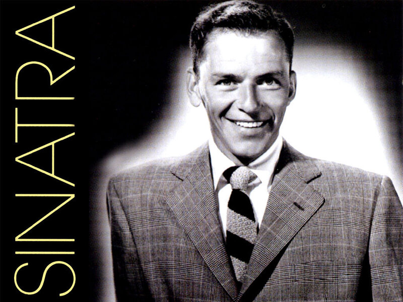 Man in Suit Smiling — Black, Dramatic, Photograph