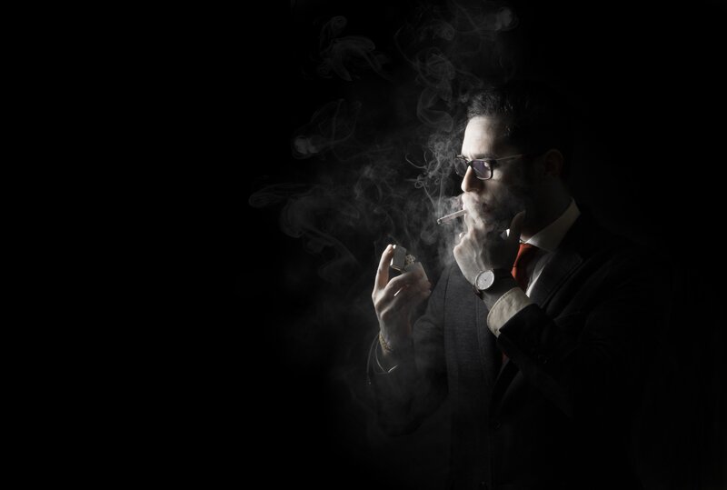 Man in Suit Smoking — Black, Dramatic, Night, Photograph