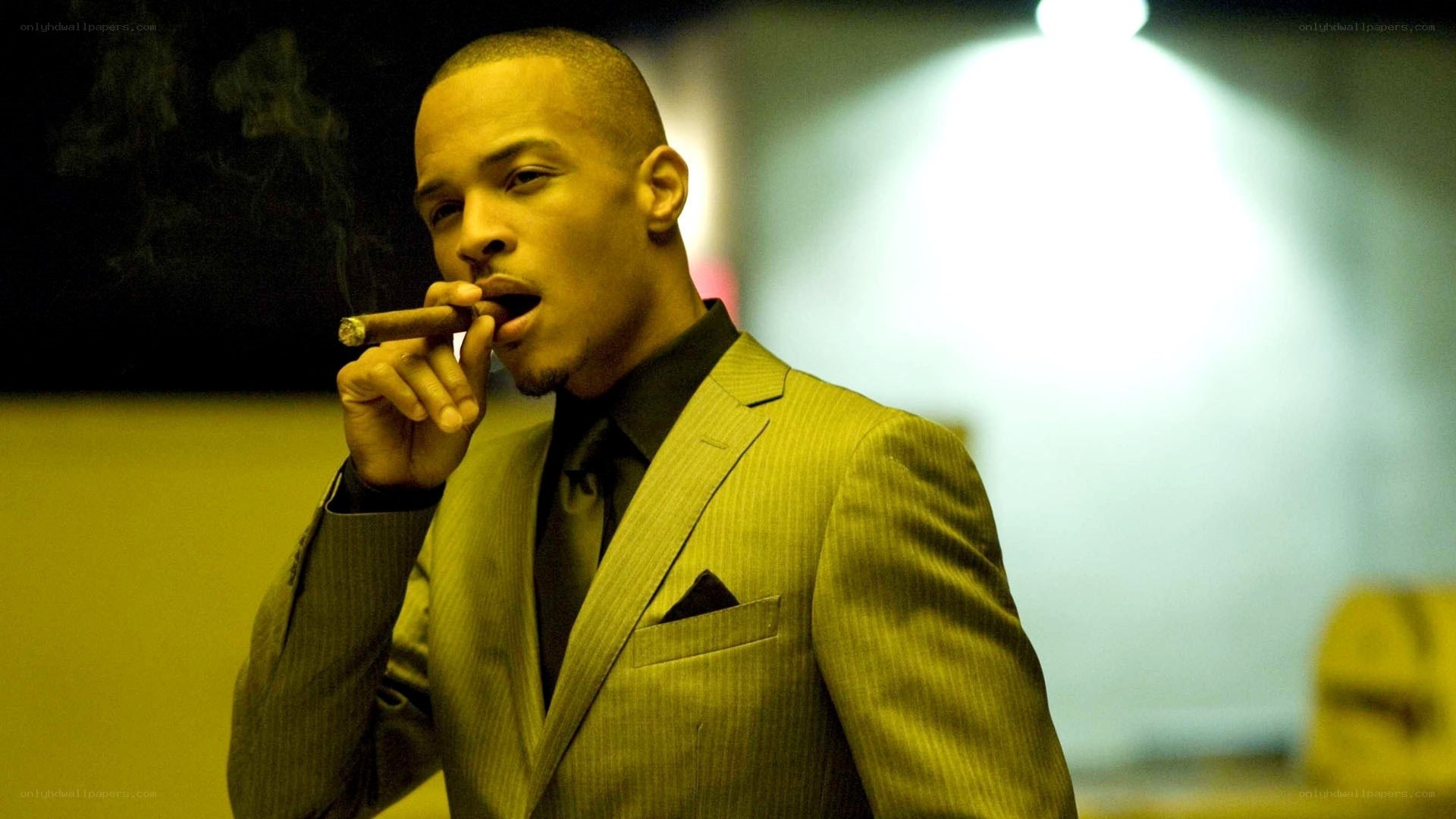 man in suit smoking cigar
