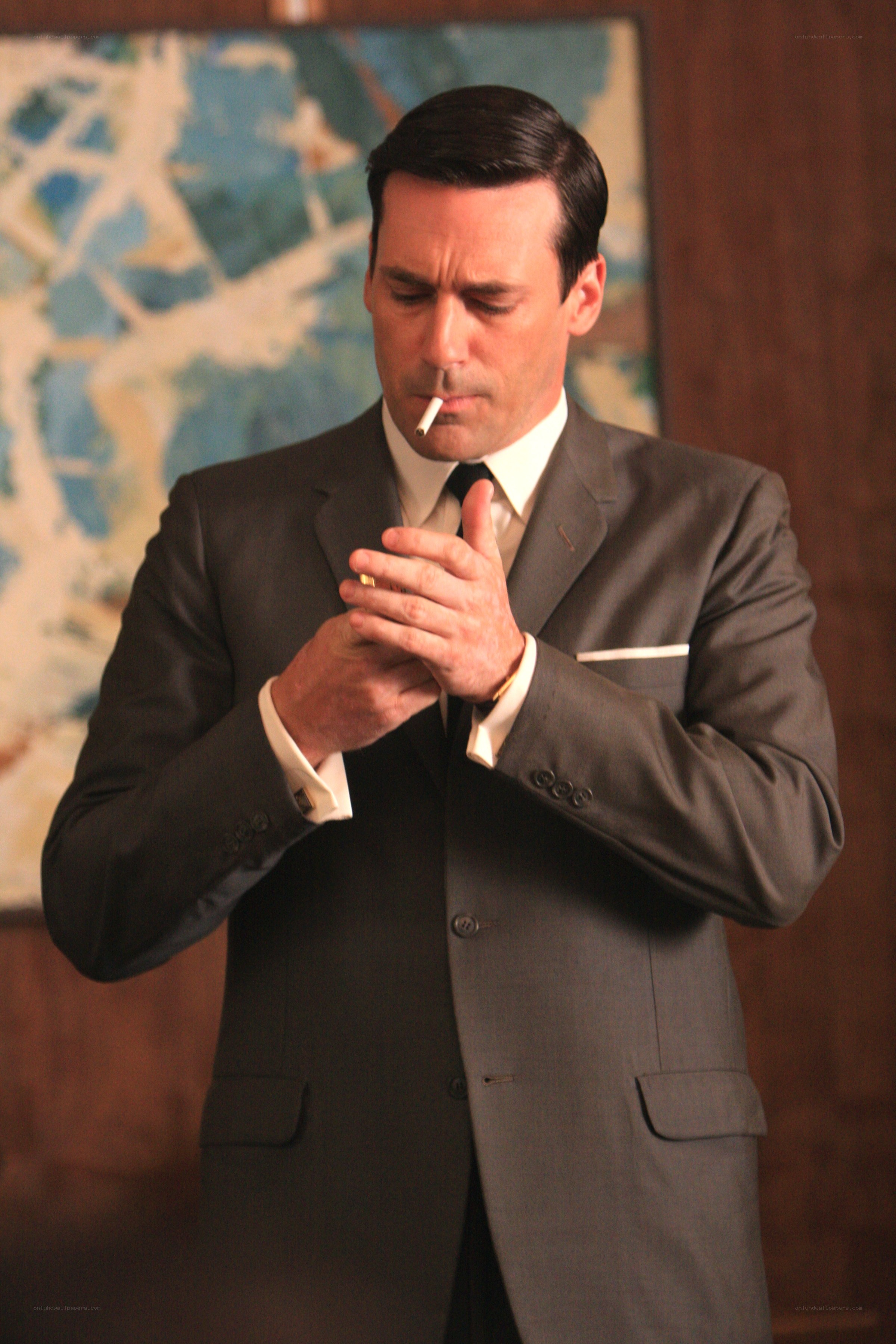 Man in suit smoking cigarette