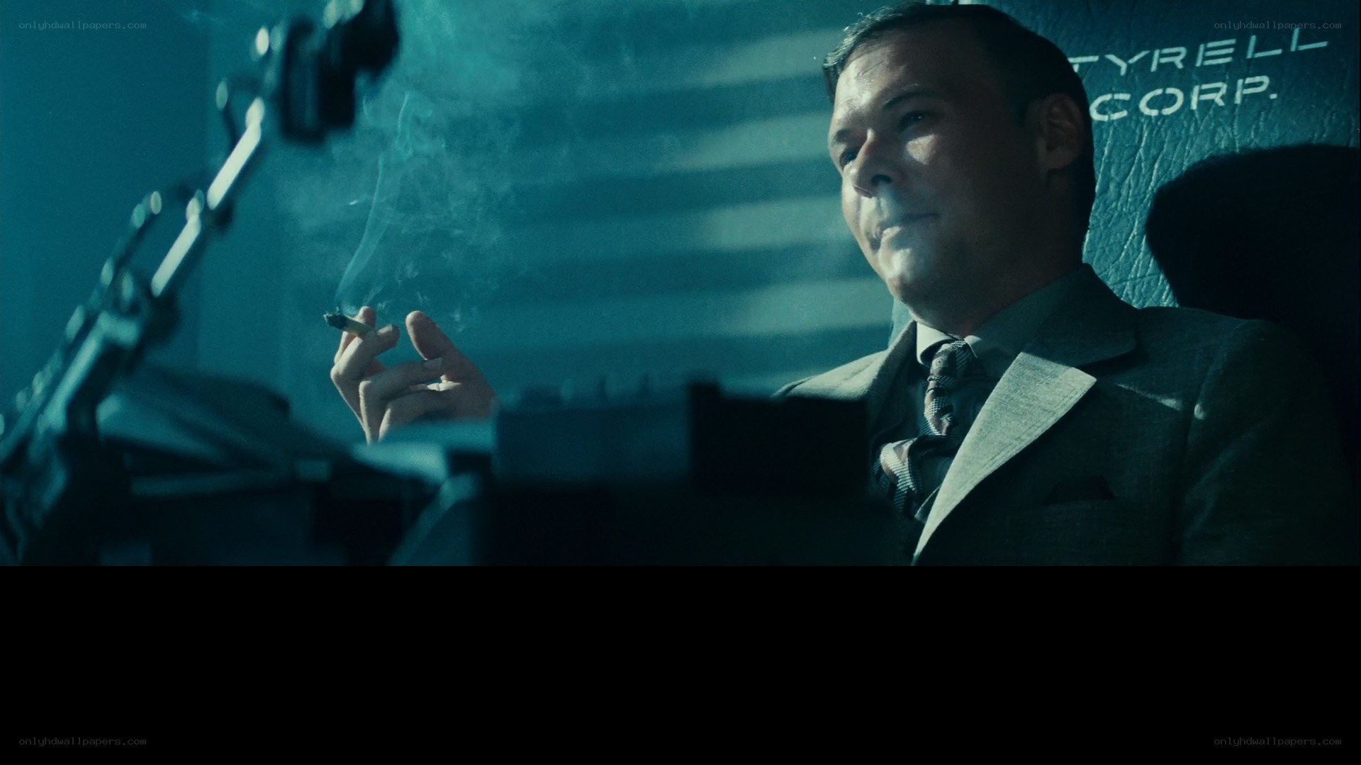 man in suit smoking cigarette