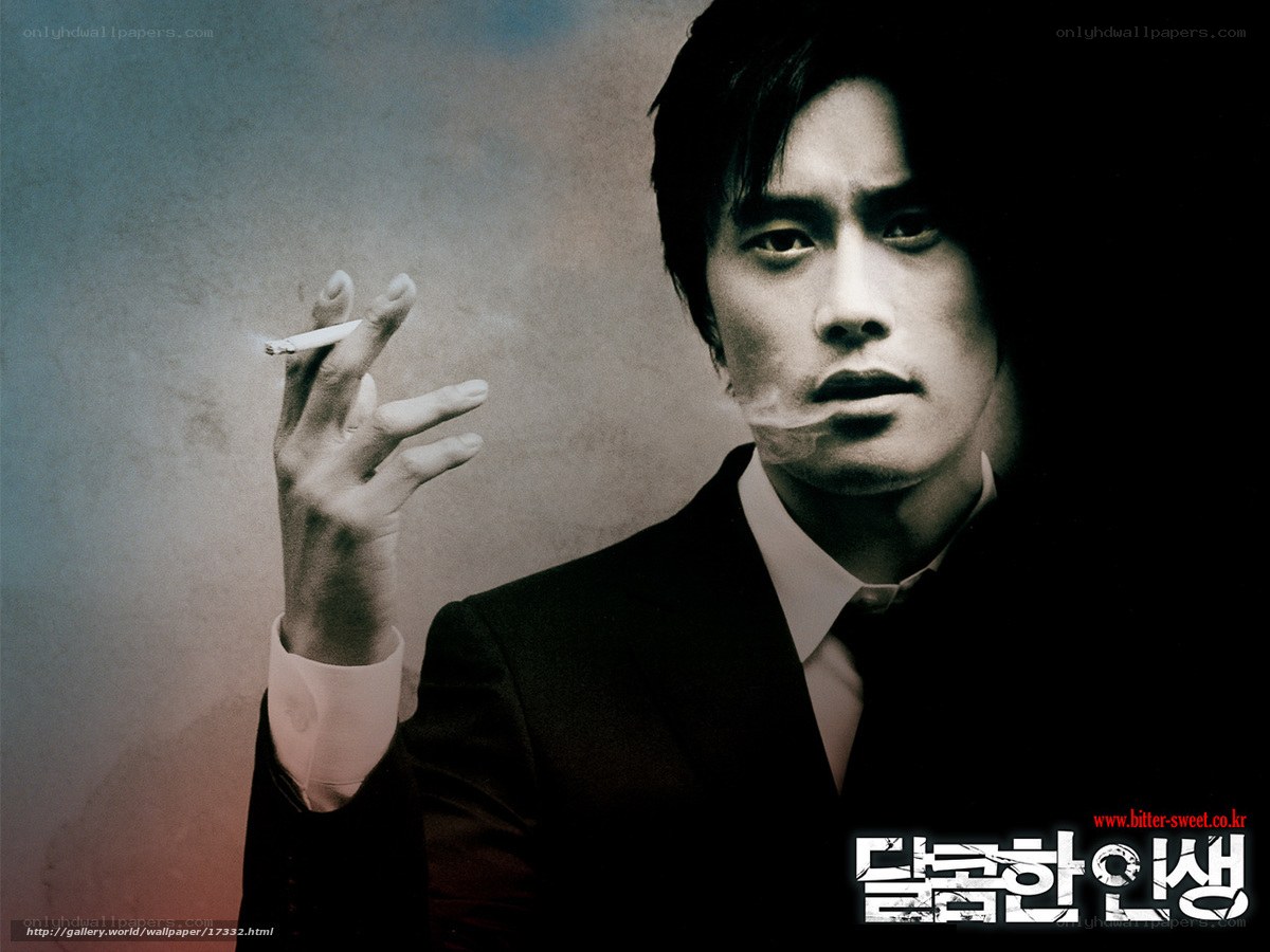 man in suit smoking cigarette