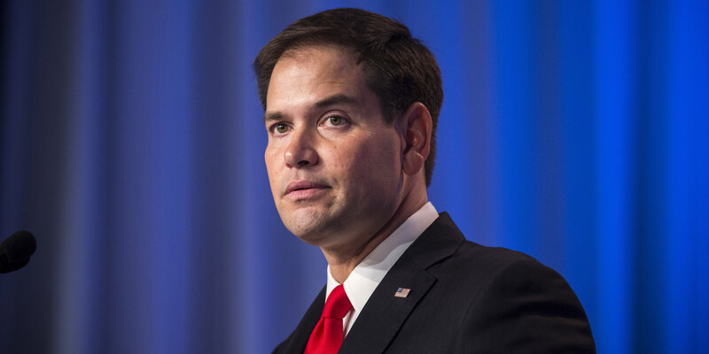 man in suit speaking