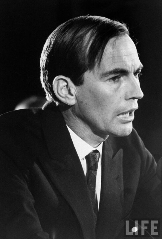 man in suit speaking