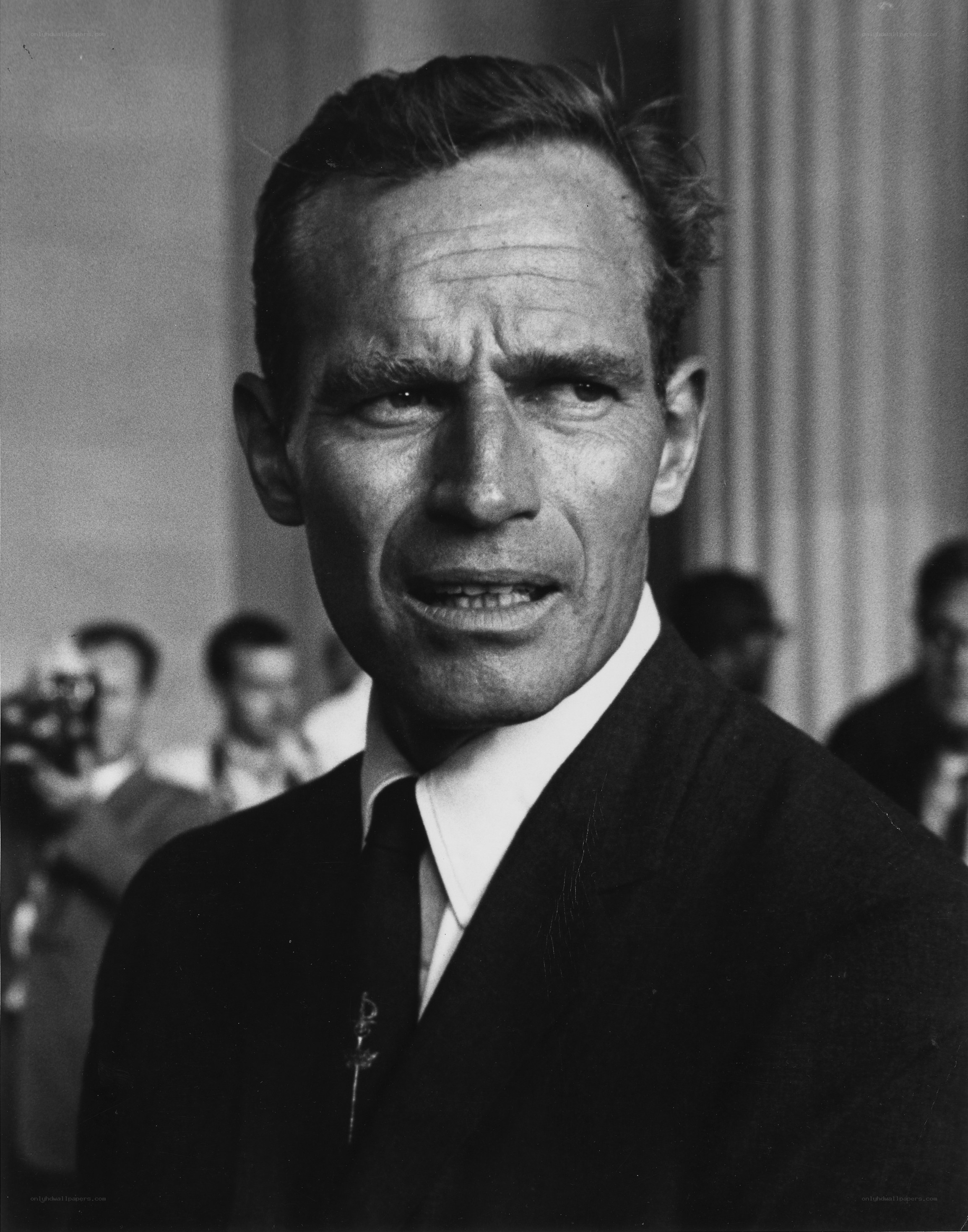 Man in suit speaking