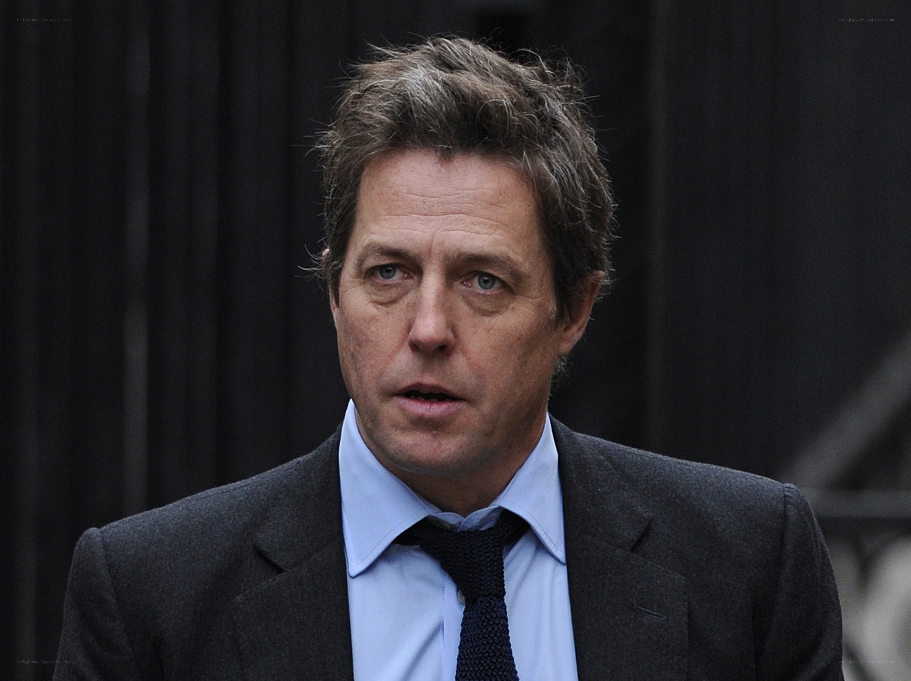 man in suit speaking