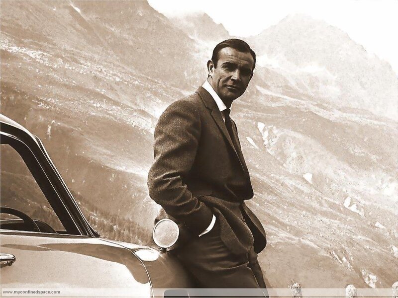 Man in Suit Standing — Brown, Dramatic, Photograph