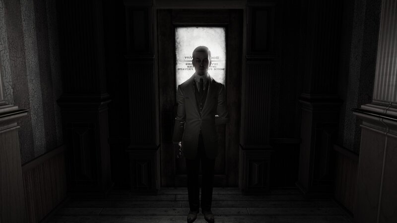 man in suit standing in hallway