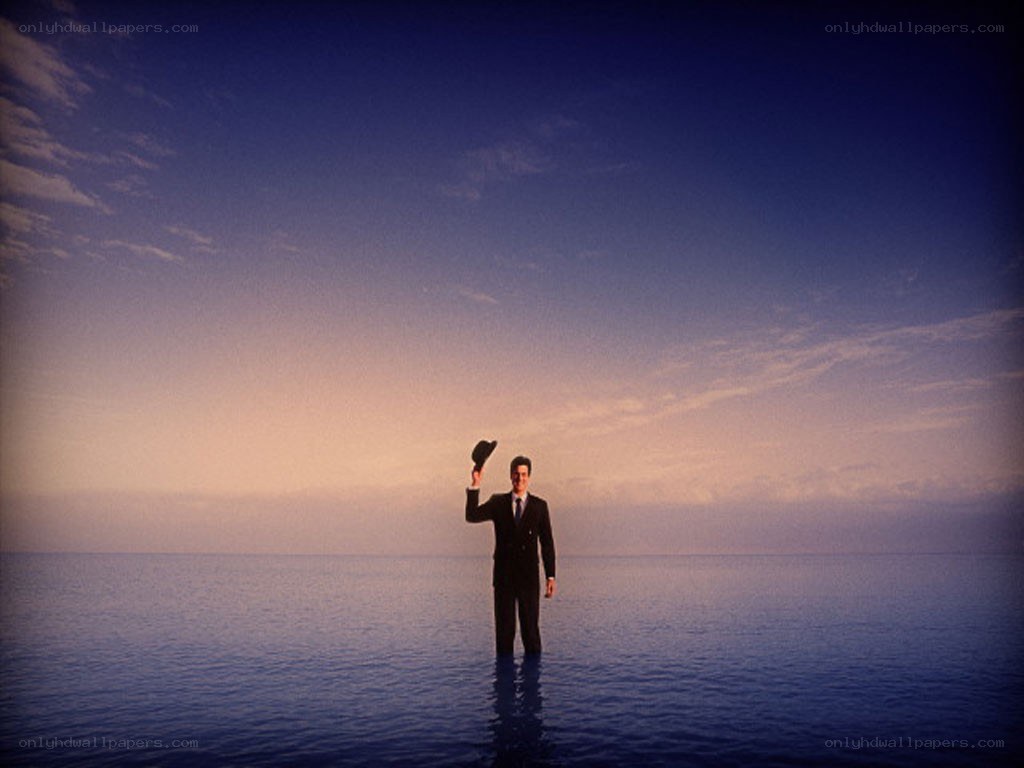man in suit standing in water