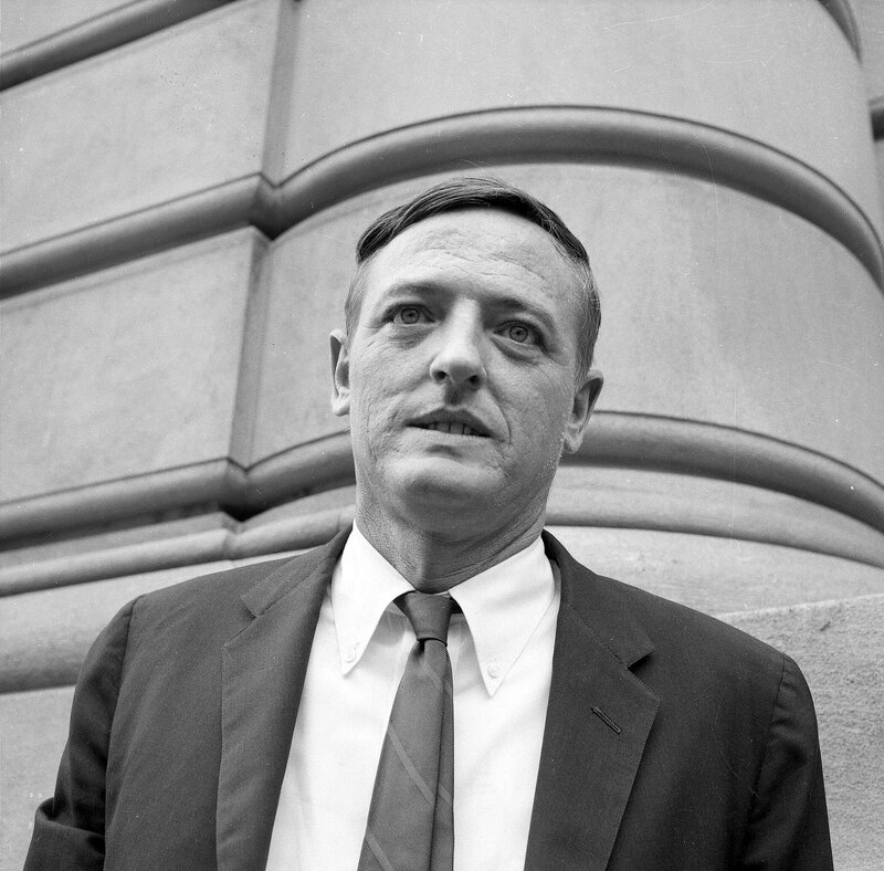 man in suit standing outside
