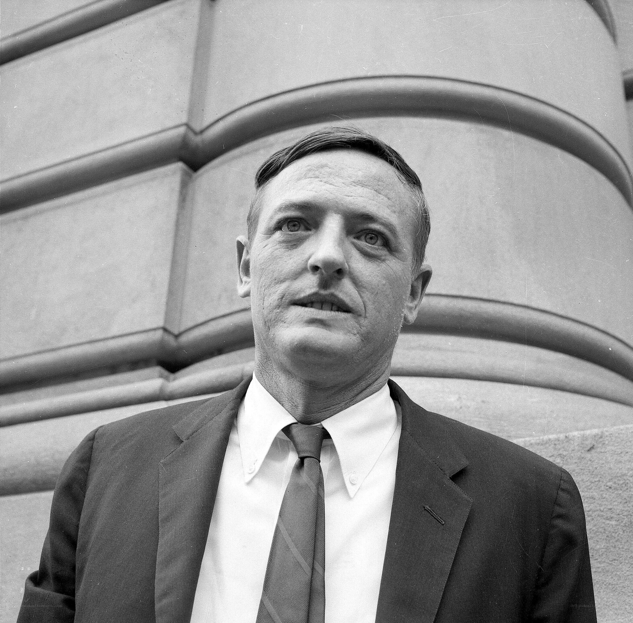 man in suit standing outside