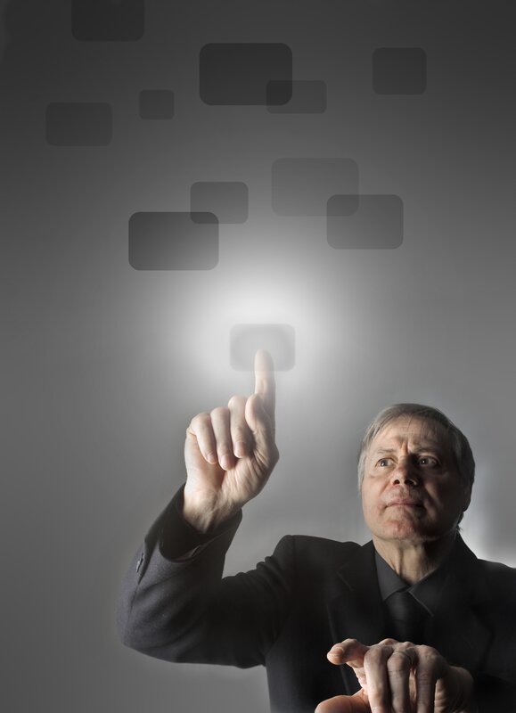 Man in Suit Touching Screen