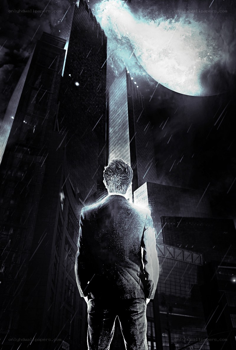 Man in suit under glowing moon