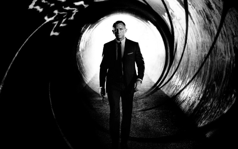 Man in Suit Walking — Black, Dramatic, Photograph