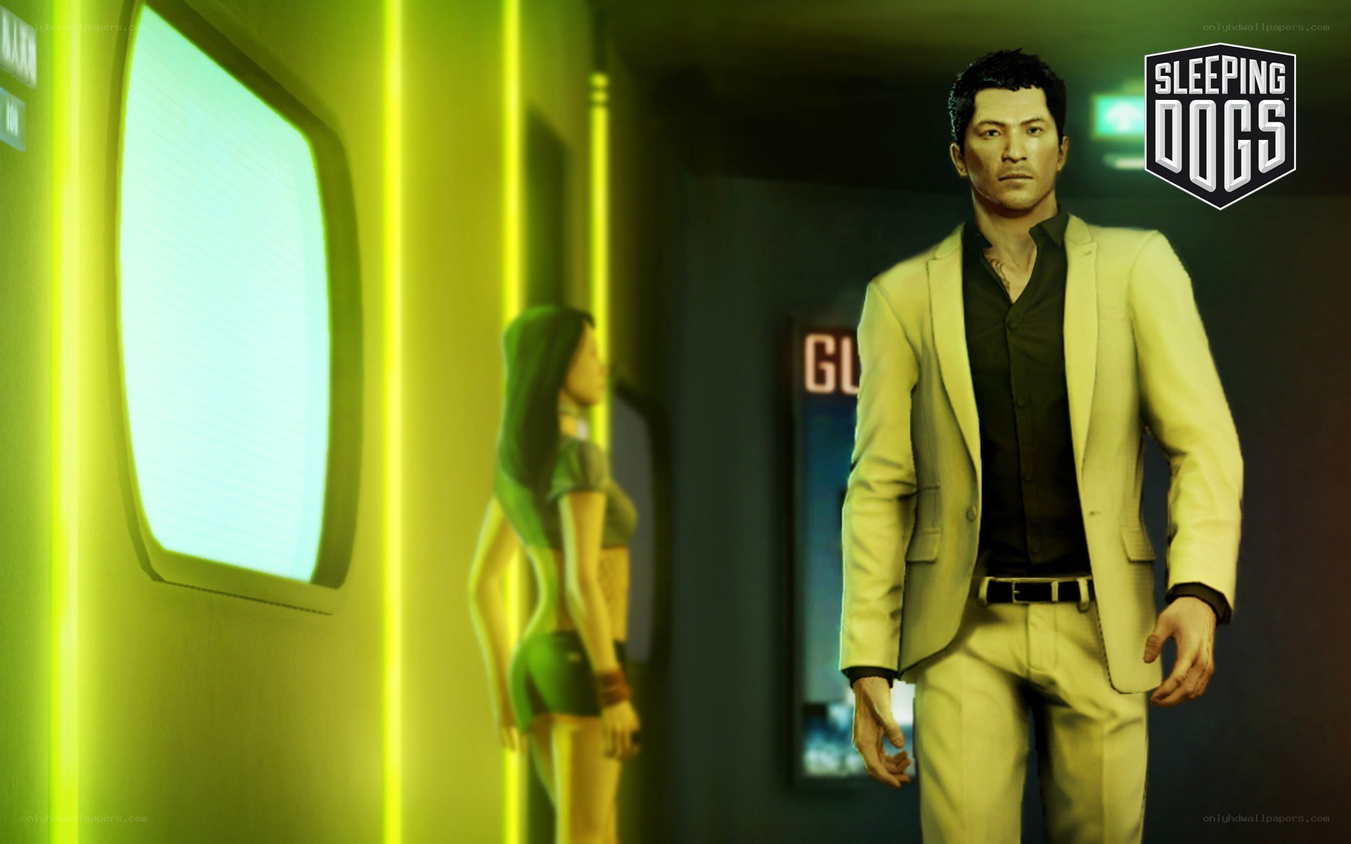 Man in suit walking down hallway