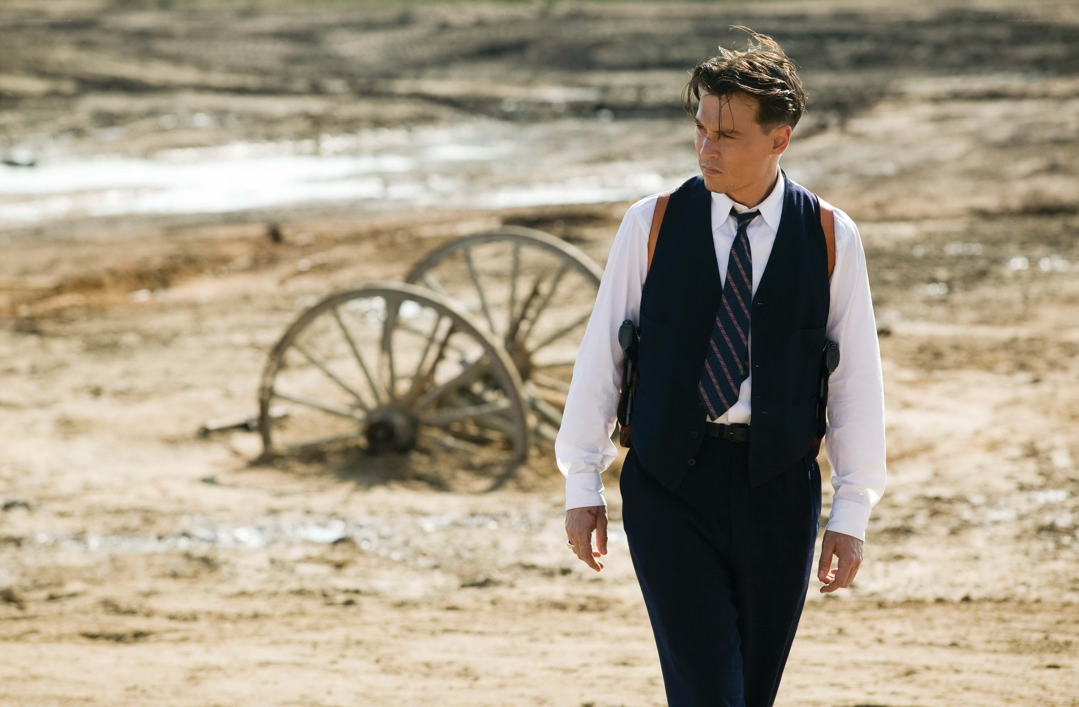 Man in suit walking in desert