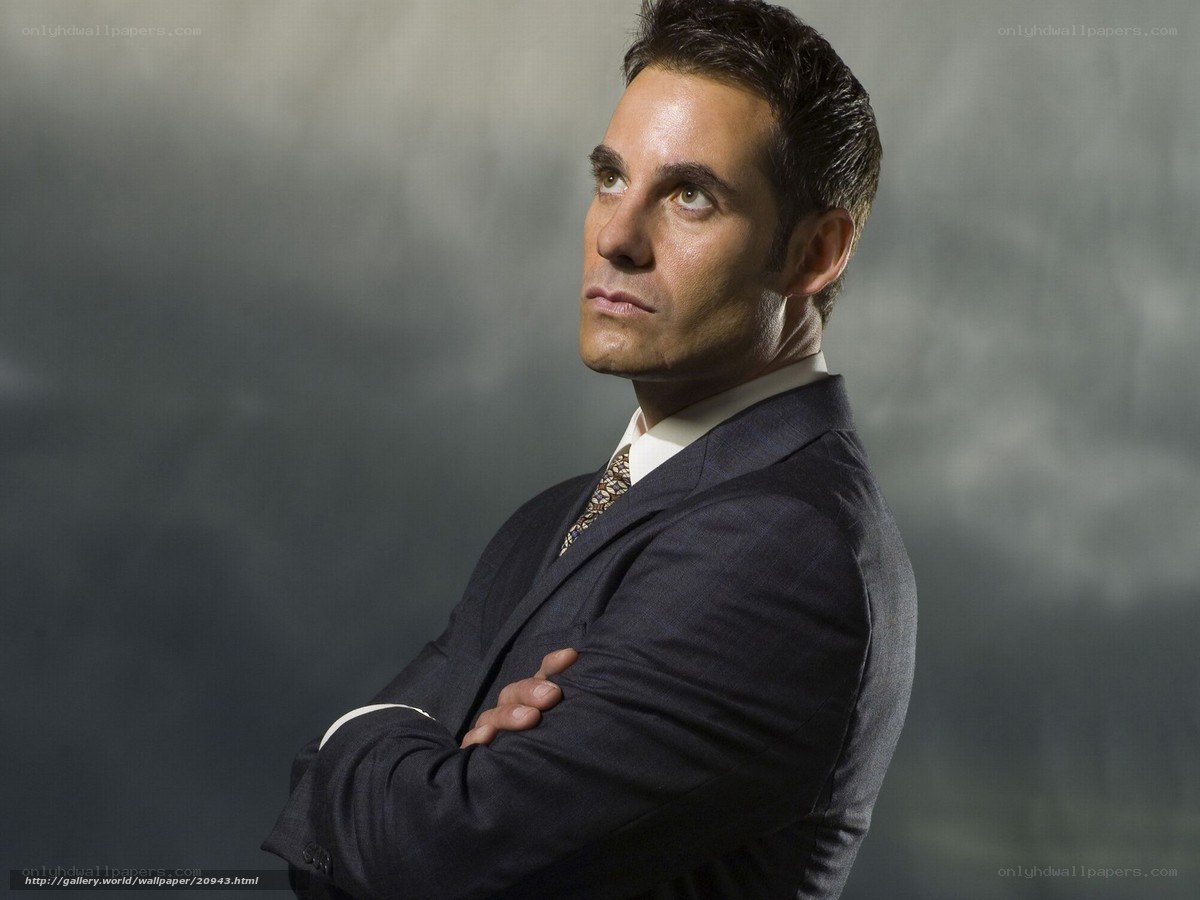 Man in suit with arms crossed
