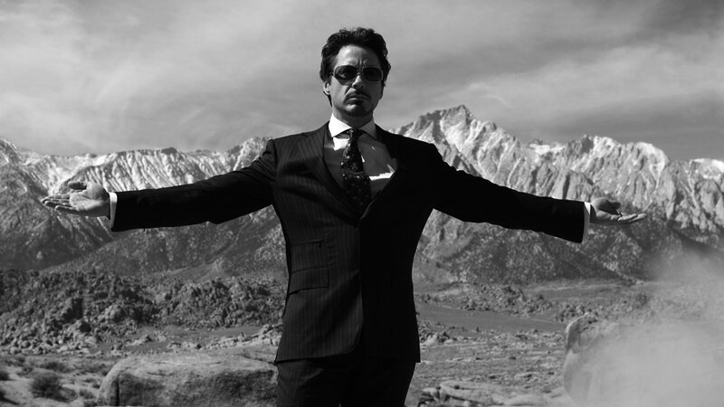 man in suit with arms outstretched